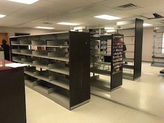 rows of empty bookshelves