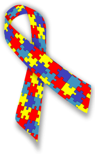 autism awareness ribbon with puzzle pattern on it in red, yellow and blue