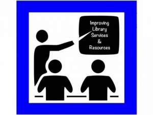 silhouettes of three people in meeting with one person standing and pointing at sign that reads Improving Library Services and Resources