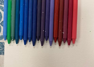 Crayons Glued to Canvas Board