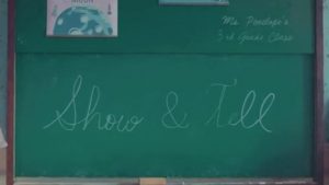 Show and Tell written on green chalkboard.