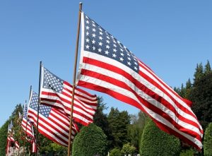 row of waving United States flags